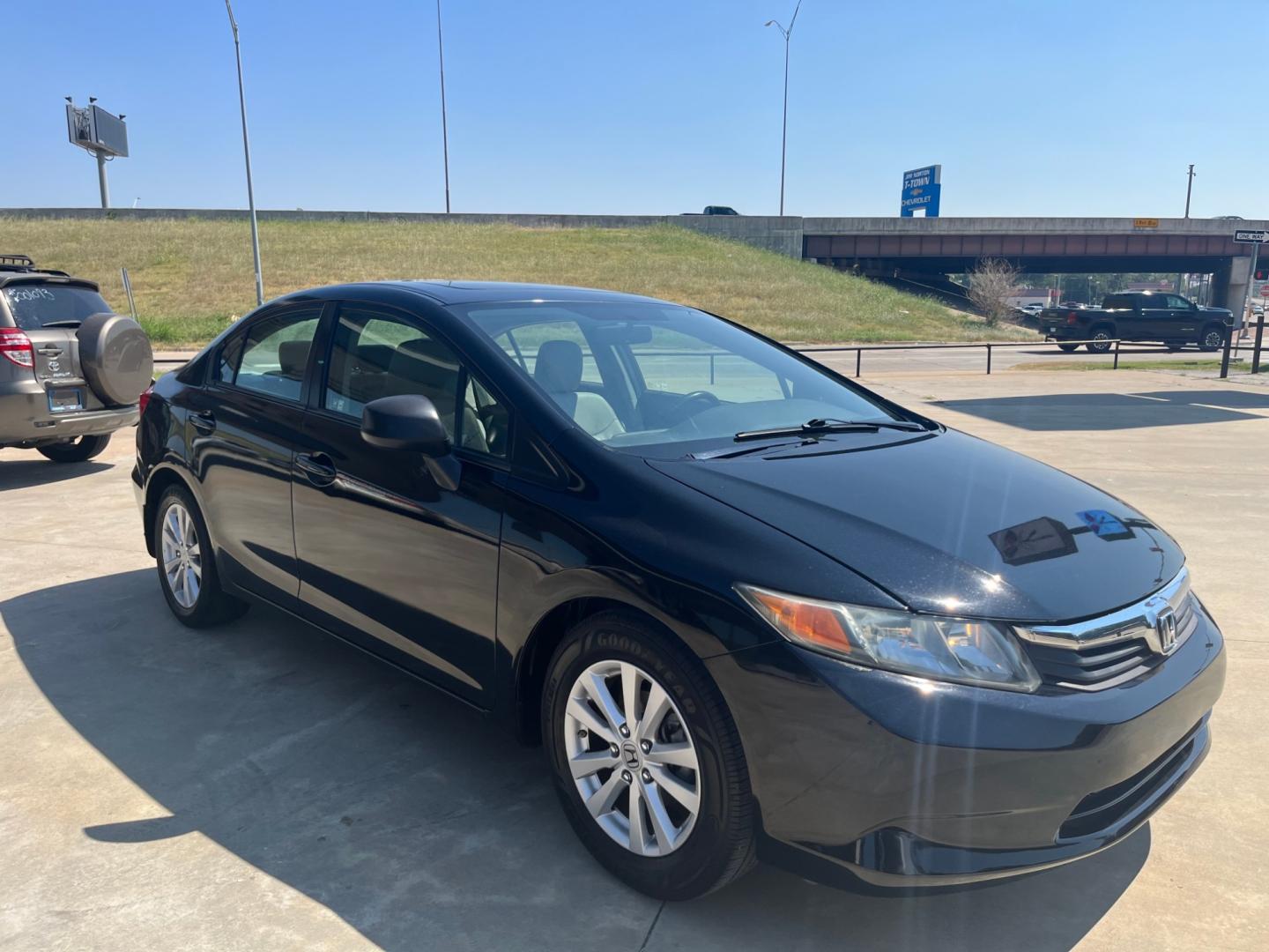 2012 BLACK HONDA CIVIC EX-L EX-L Sedan 5-Speed AT (2HGFB2F97CH) with an 1.8L L4 SOHC 16V engine, 5-Speed Automatic transmission, located at 8101 E. Skelly Dr., Tulsa, OK, 74129, (918) 592-3593, 36.121891, -95.888802 - Photo#1