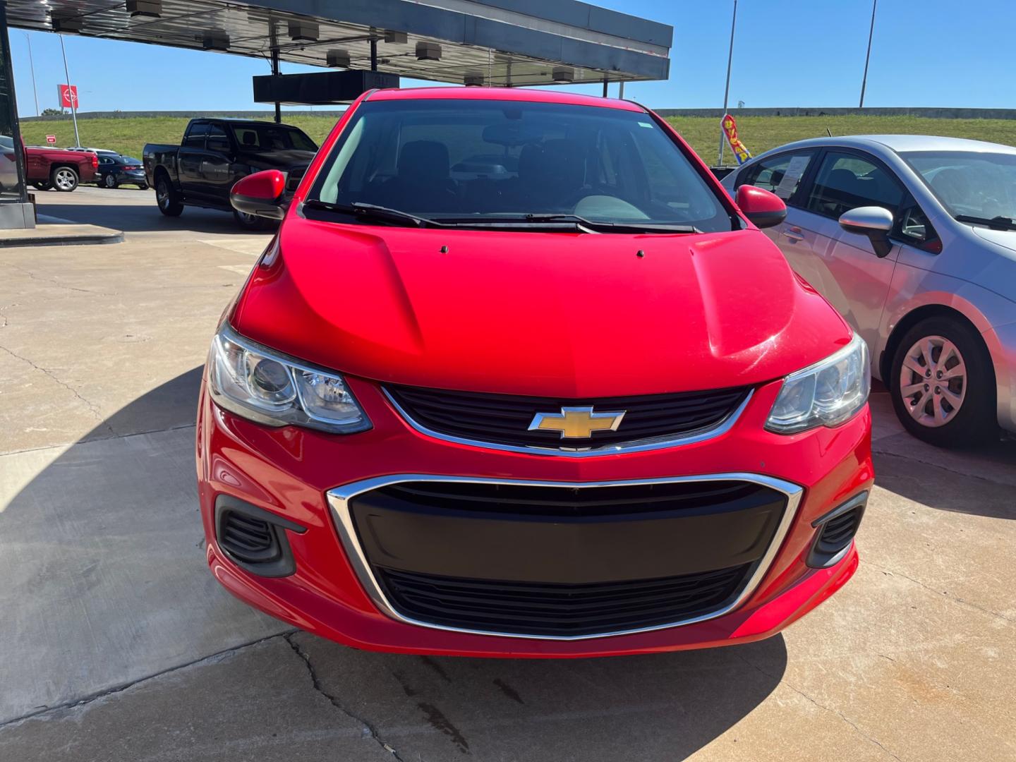 2017 RED CHEVROLET SONIC LS LS Manual Sedan (1G1JB5SH0H4) with an 1.8L L4 DOHC 24V engine, 5M transmission, located at 8101 E. Skelly Dr., Tulsa, OK, 74129, (918) 592-3593, 36.121891, -95.888802 - Photo#1