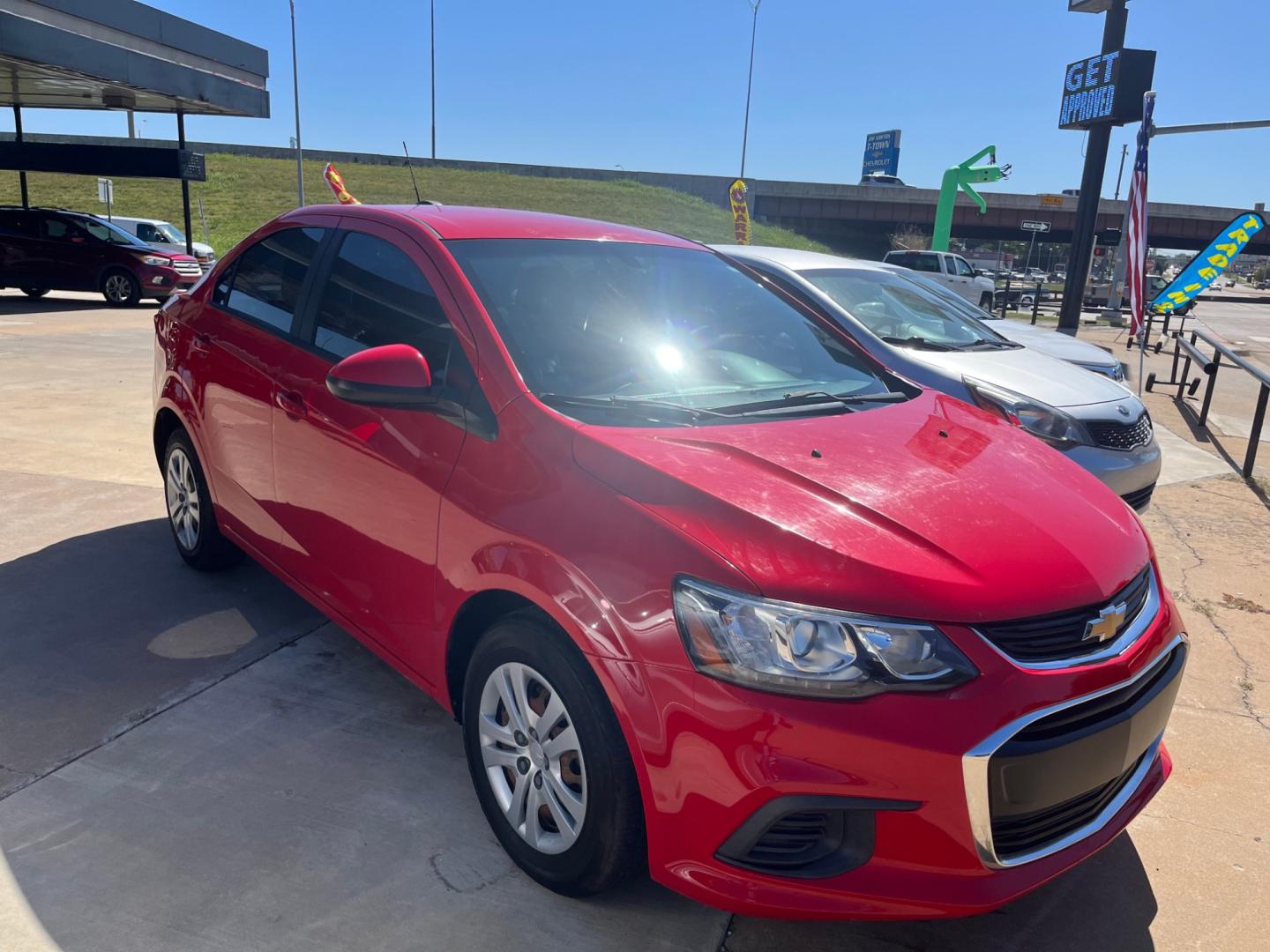 2017 RED CHEVROLET SONIC LS LS Manual Sedan (1G1JB5SH0H4) with an 1.8L L4 DOHC 24V engine, 5M transmission, located at 8101 E. Skelly Dr., Tulsa, OK, 74129, (918) 592-3593, 36.121891, -95.888802 - Photo#2