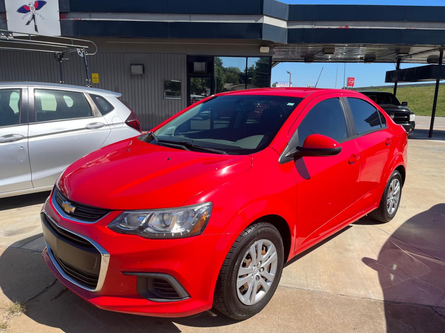 2017 RED CHEVROLET SONIC LS LS Manual Sedan (1G1JB5SH0H4) with an 1.8L L4 DOHC 24V engine, 5M transmission, located at 8101 E. Skelly Dr., Tulsa, OK, 74129, (918) 592-3593, 36.121891, -95.888802 - Photo#3