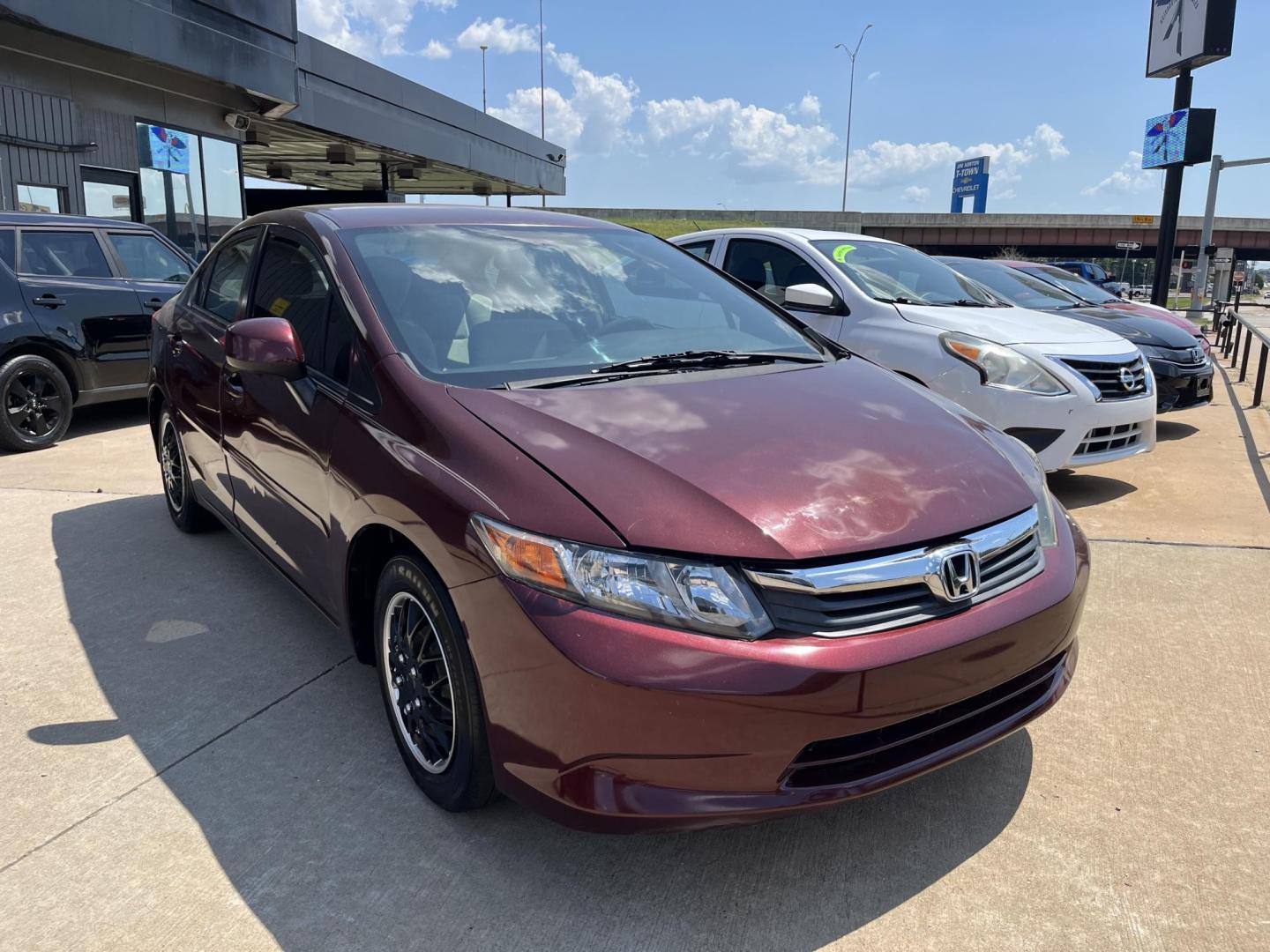 2012 MAROON HONDA CIVIC LX LX Sedan 5-Speed AT (19XFB2F52CE) with an 1.8L L4 SOHC 16V engine, 5-Speed Automatic transmission, located at 8101 E. Skelly Dr., Tulsa, OK, 74129, (918) 592-3593, 36.121891, -95.888802 - Photo#0