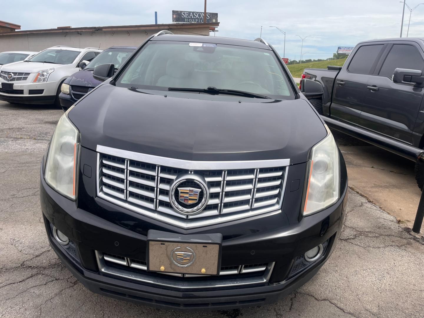 2014 BLACK CADILLAC SRX PERFORMANCE Performance Collection AWD (3GYFNFE31ES) with an 3.6L V6 DOHC 24V FFV engine, 6-Speed Automatic transmission, located at 8101 E. Skelly Dr., Tulsa, OK, 74129, (918) 592-3593, 36.121891, -95.888802 - Photo#2