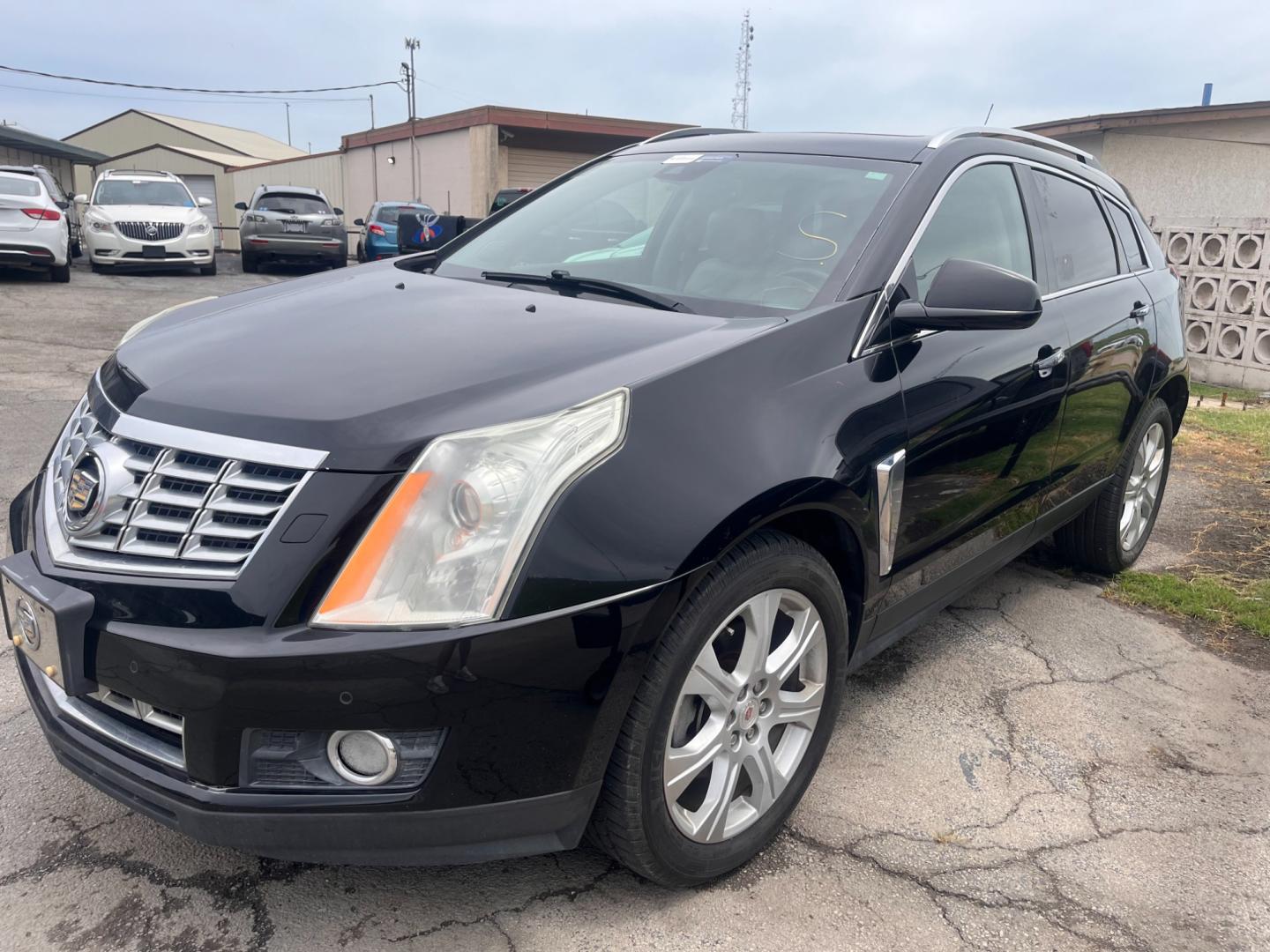 2014 BLACK CADILLAC SRX PERFORMANCE Performance Collection AWD (3GYFNFE31ES) with an 3.6L V6 DOHC 24V FFV engine, 6-Speed Automatic transmission, located at 8101 E. Skelly Dr., Tulsa, OK, 74129, (918) 592-3593, 36.121891, -95.888802 - Photo#0