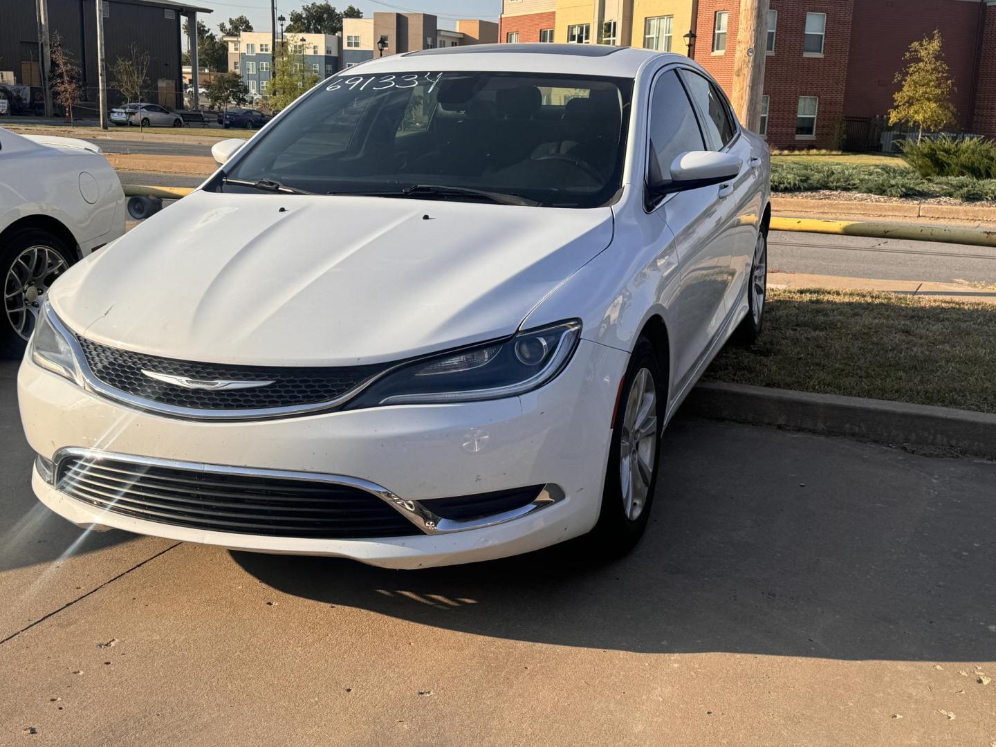 2015 WHITE CHRYSLER 200 LIMITED Limited (1C3CCCABXFN) with an 2.4L L4 DOHC 16V engine, 9-Speed Automatic transmission, located at 8101 E. Skelly Dr., Tulsa, OK, 74129, (918) 592-3593, 36.121891, -95.888802 - Photo#0