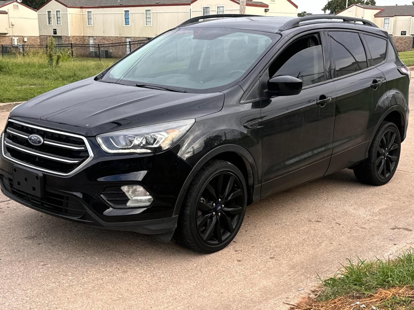 2018 BLACK FORD ESCAPE SE SE FWD (1FMCU0GD4JU) with an 1.5L L4 DOHC 16V engine, 6A transmission, located at 8101 E. Skelly Dr., Tulsa, OK, 74129, (918) 592-3593, 36.121891, -95.888802 - Photo#0