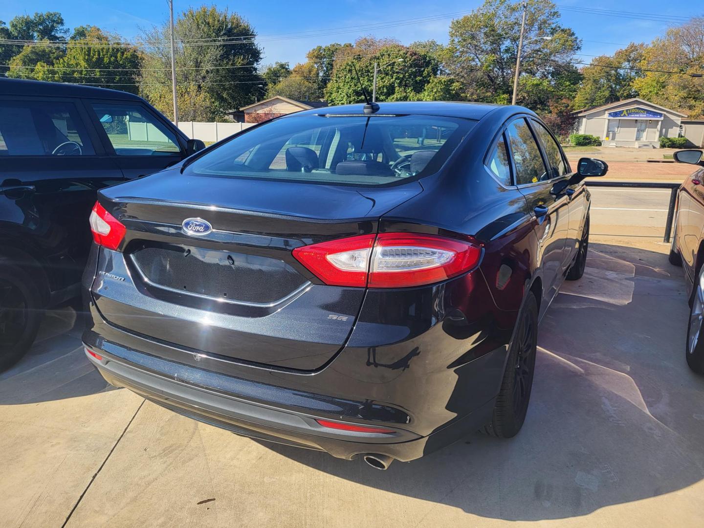 2014 BLACK FORD FUSION SE SE (1FA6P0H79E5) with an 2.5L L4 DOHC 16V engine, located at 8101 E. Skelly Dr., Tulsa, OK, 74129, (918) 592-3593, 36.121891, -95.888802 - Photo#1