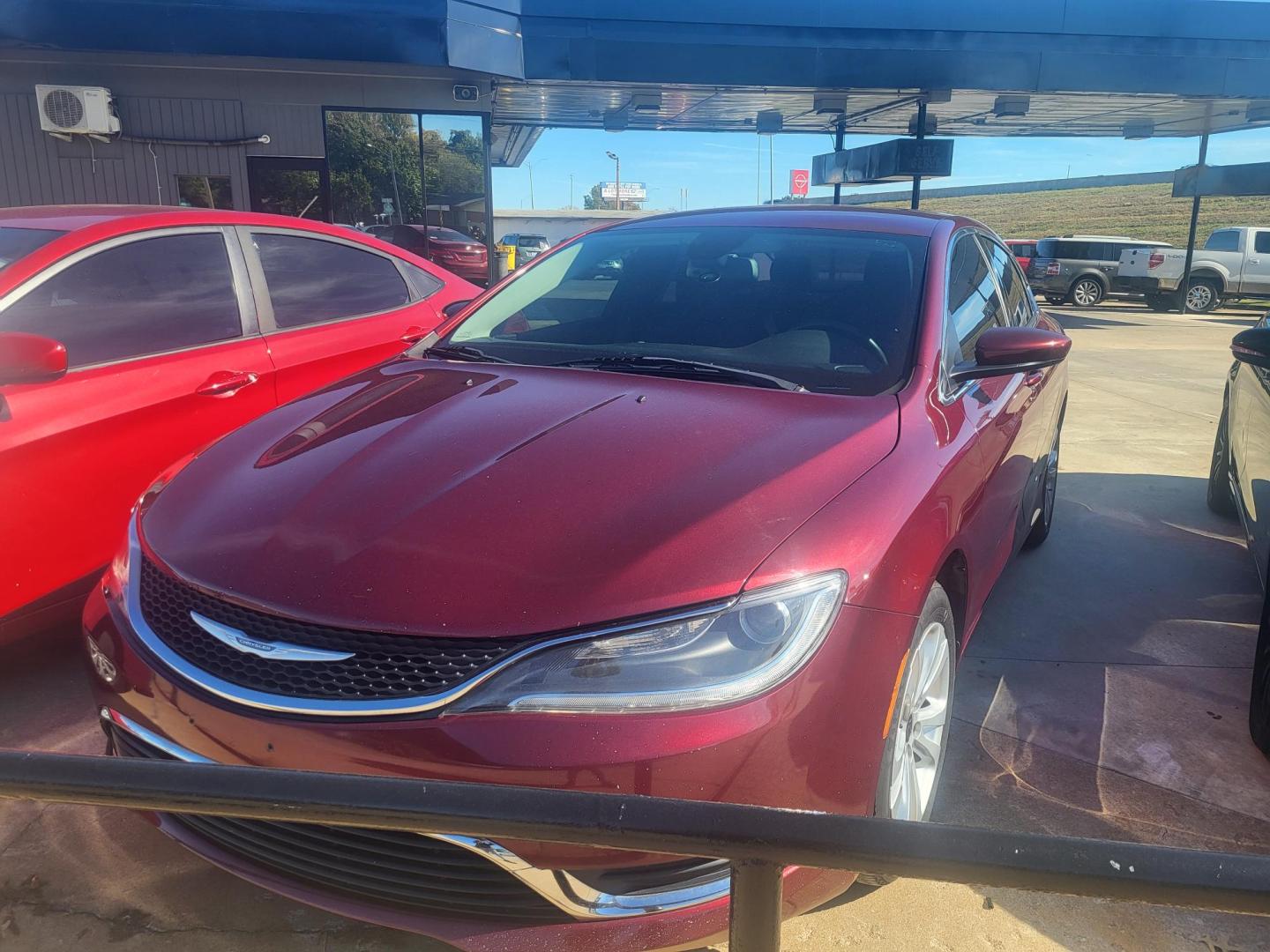 2016 RED CHRYSLER 200 LIMITED Limited (1C3CCCAB5GN) with an 2.4L L4 DOHC 16V engine, 9A transmission, located at 8101 E. Skelly Dr., Tulsa, OK, 74129, (918) 592-3593, 36.121891, -95.888802 - Photo#0