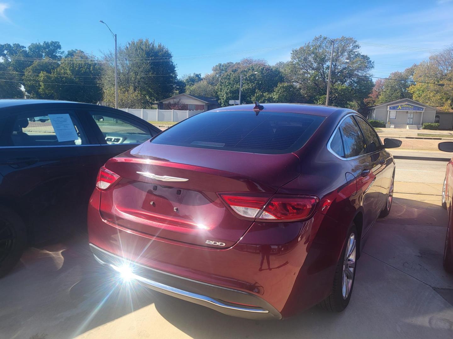 2016 RED CHRYSLER 200 LIMITED Limited (1C3CCCAB5GN) with an 2.4L L4 DOHC 16V engine, 9A transmission, located at 8101 E. Skelly Dr., Tulsa, OK, 74129, (918) 592-3593, 36.121891, -95.888802 - Photo#1