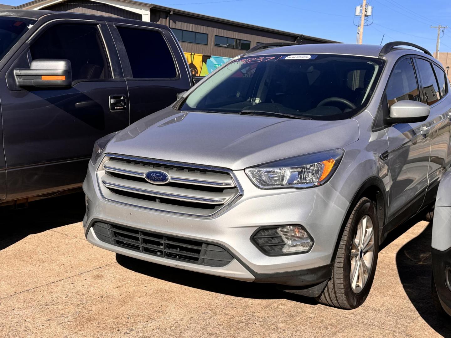 2018 SILVER FORD ESCAPE SE SE 4WD (1FMCU9GD0JU) with an 1.5L L4 DOHC 16V engine, 6A transmission, located at 8101 E. Skelly Dr., Tulsa, OK, 74129, (918) 592-3593, 36.121891, -95.888802 - Photo#0