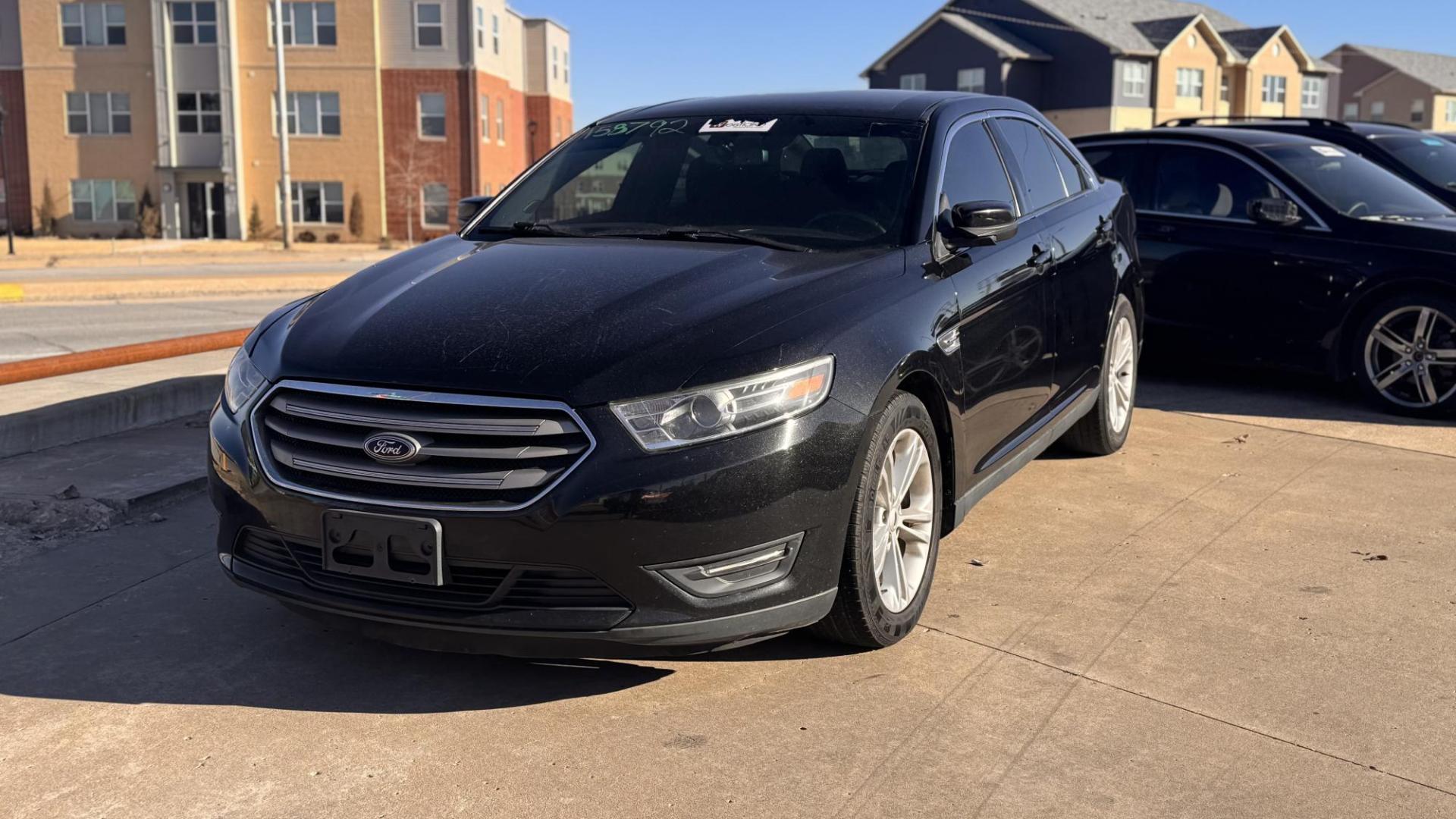 2016 BLACK Ford Taurus SEL FWD (1FAHP2E8XGG) with an 3.5L V6 DOHC 24V engine, 6A transmission, located at 8101 E. Skelly Dr., Tulsa, OK, 74129, (918) 592-3593, 36.121891, -95.888802 - Photo#0